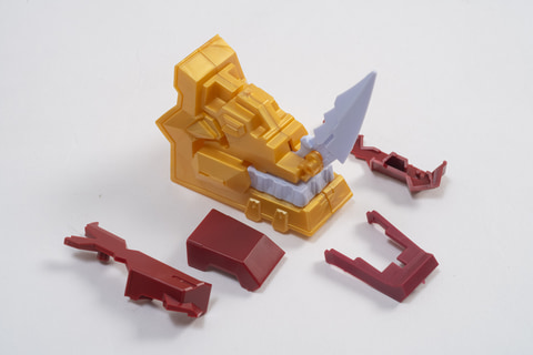 First, the shoulder parts. We'll create a gimmick that makes the horns pop out.